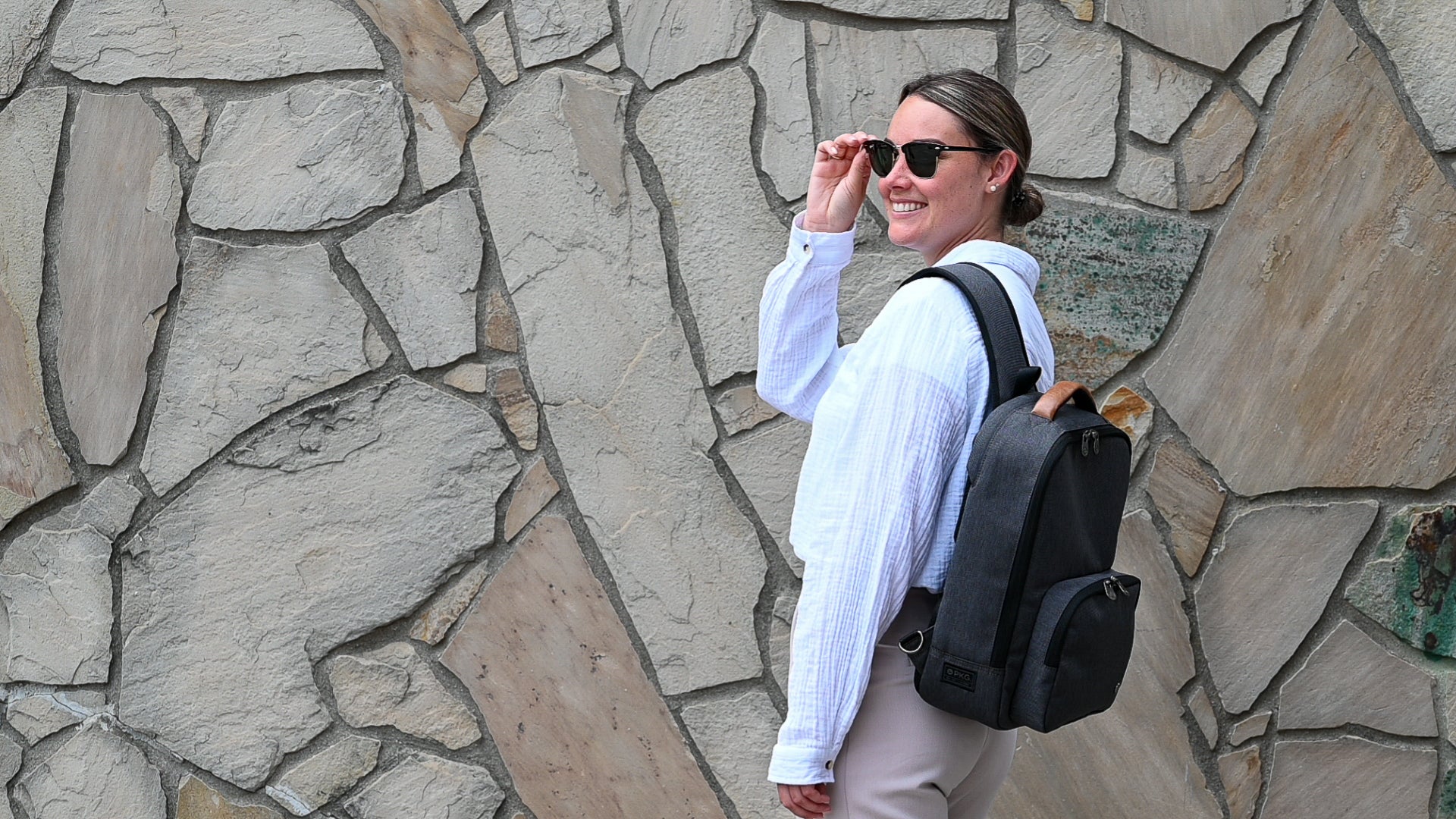 Woman wearing PKG Robson 12L Cross-Body Laptop Bag