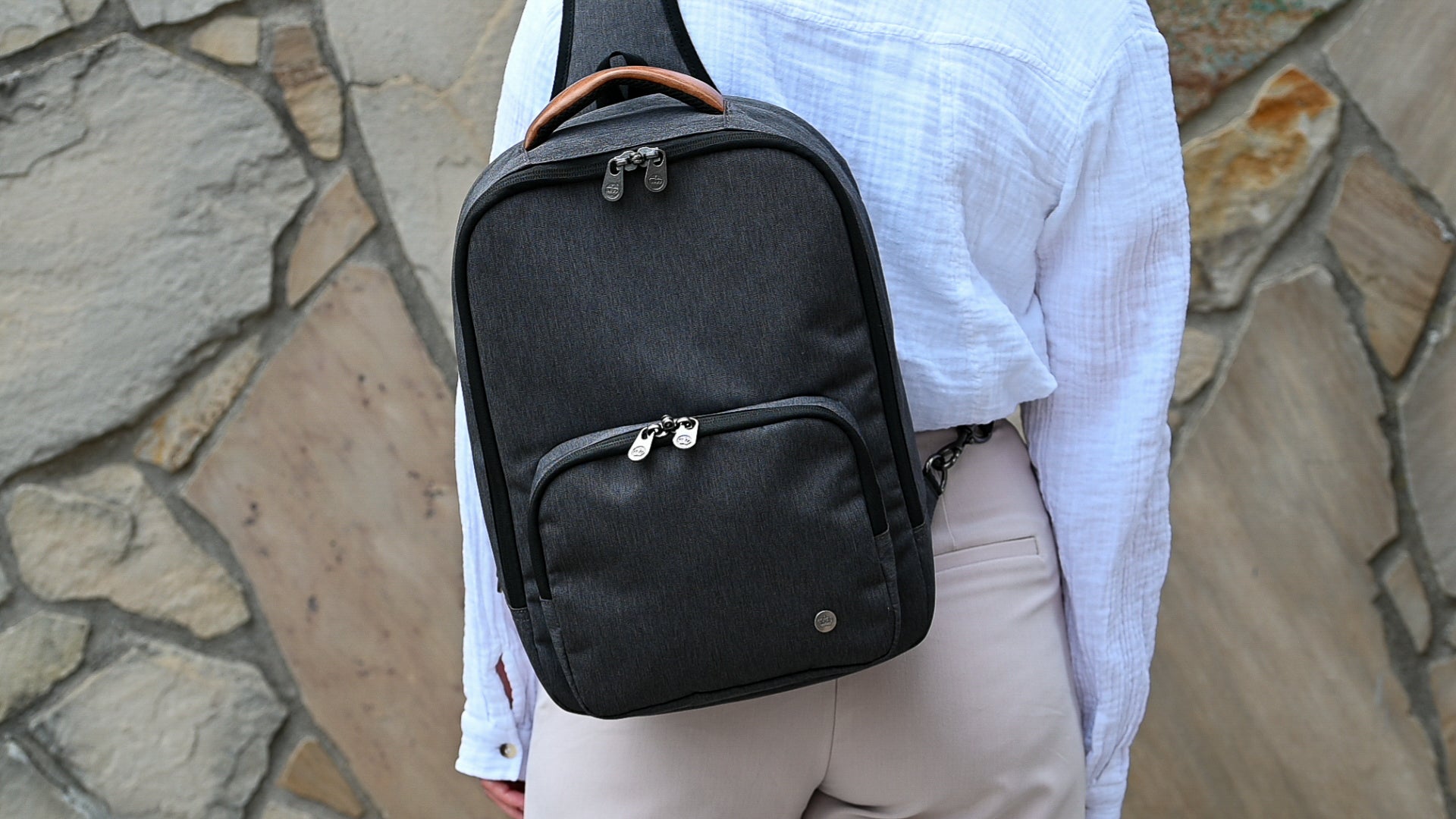 Woman wearing PKG Robson 12L Cross-Body Laptop Bag on back