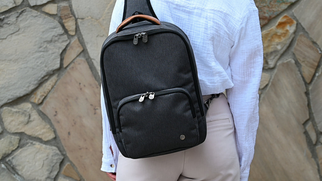 Woman wearing PKG Robson 12L Cross-Body Laptop Bag on back