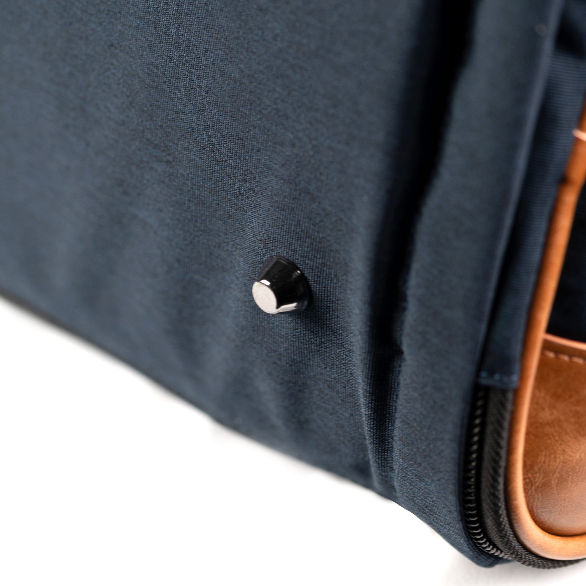 PKG Bishop 42L Recycled Duffle Bag (navy) detailed view of metal feet to ensure contents are protected
