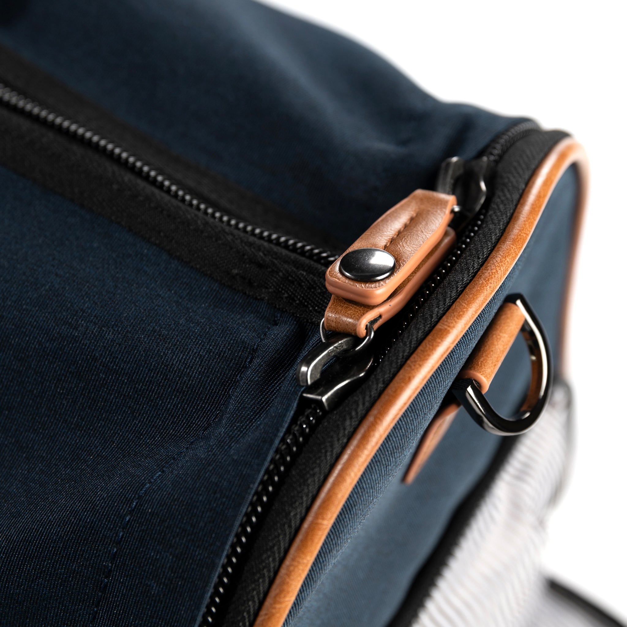 PKG Bishop 42L Recycled Duffle Bag (navy) detailed view of snap lock zippers