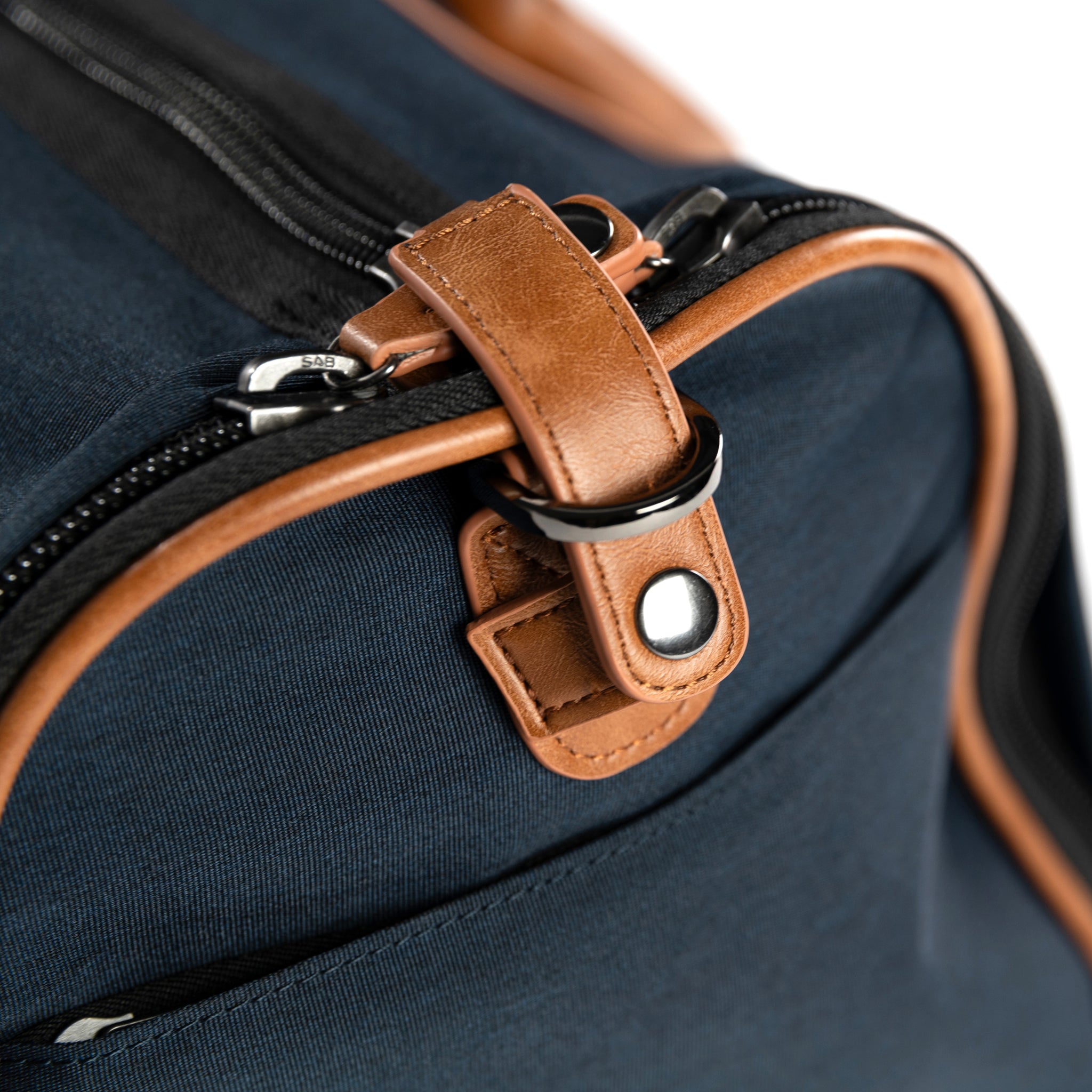PKG Bishop 42L Recycled Duffle Bag (navy) d-ring for adjustable strap attachment, used to secure zippers