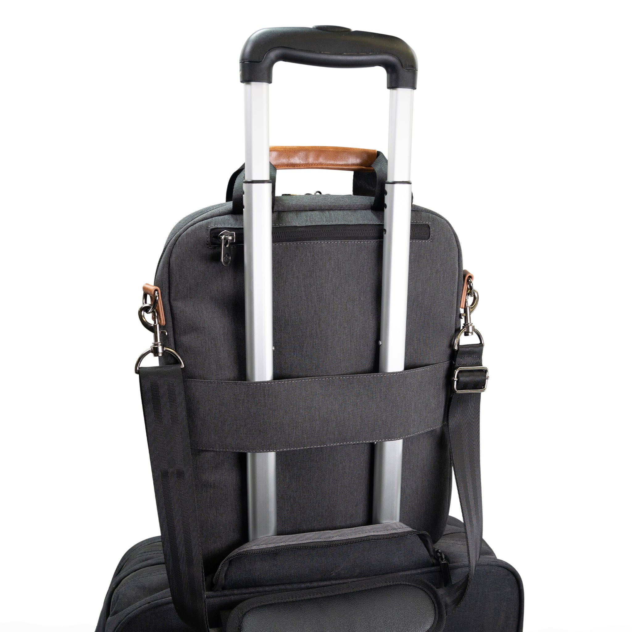 PKG Riverdale 11L Messenger Bag attached to luggage handle using trolley strap