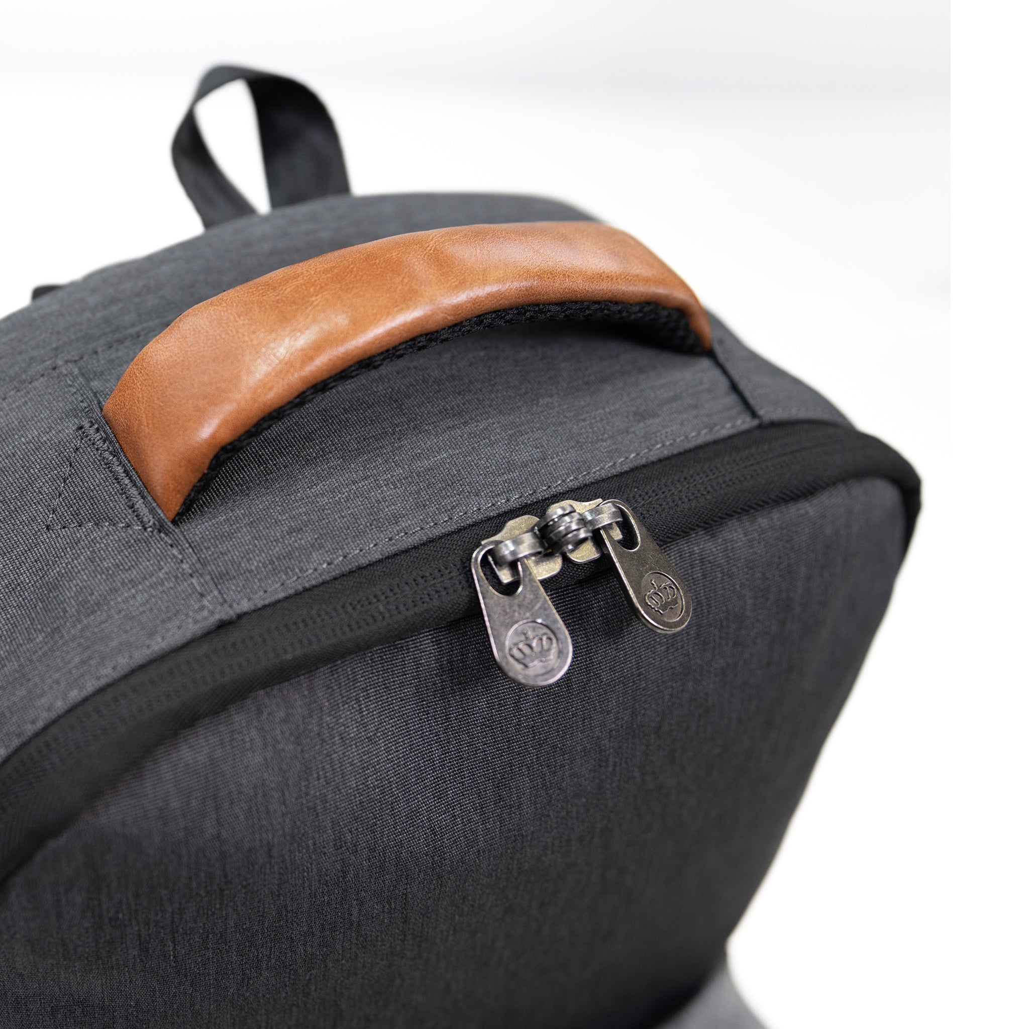 PKG Robson 12L Cross-Body Laptop Bag top view showing lockable zippers and vegan leather handle