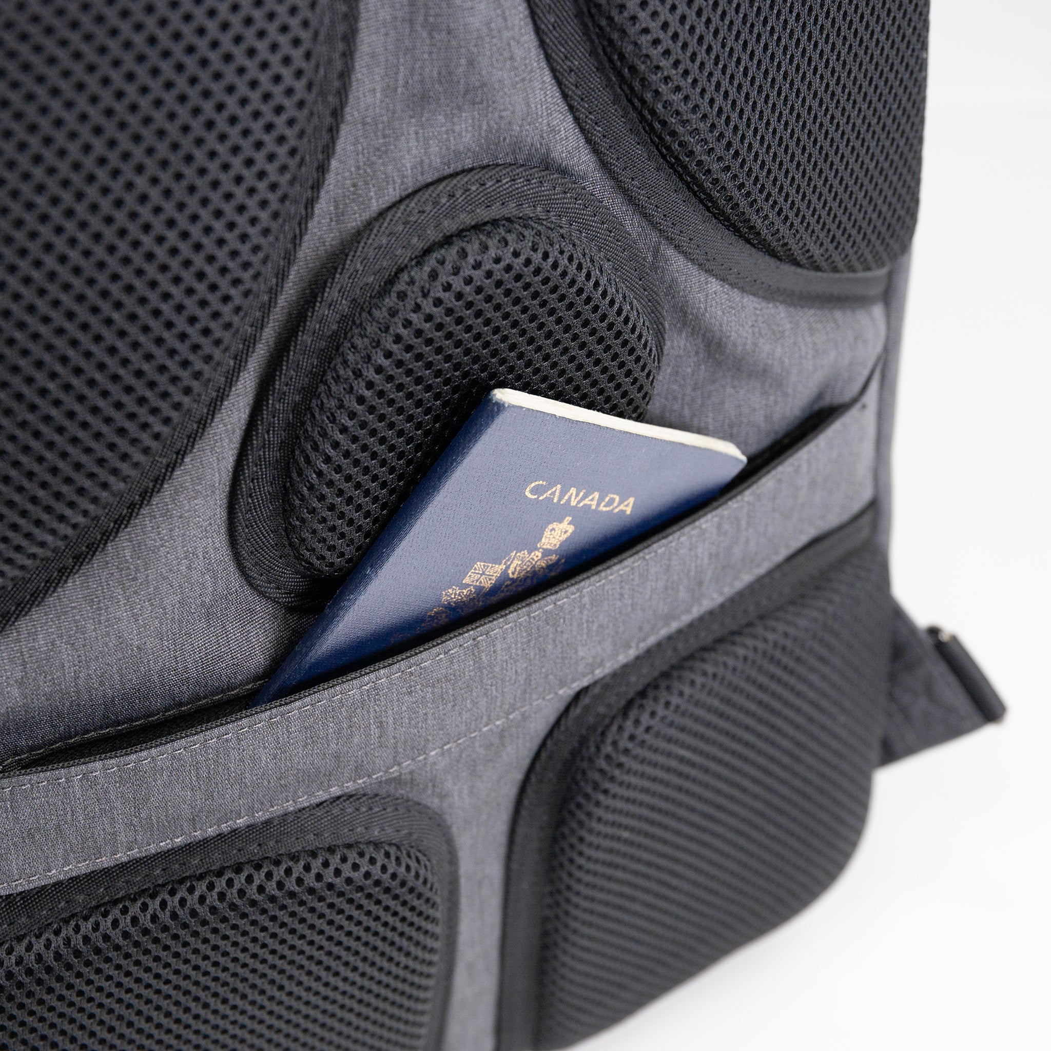 PKG Robson 12L Cross-Body Laptop Bag showing hidden passport pocket on the back
