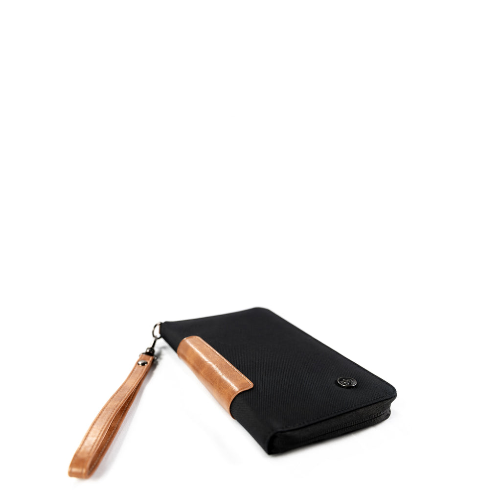 Victoria RFID Clutch Wallet (black) – crafted from durable, sustainable vegan leather. Safely store 6 cards, passport, boarding pass, pen, and cash in this stylish and organized travel wallet.