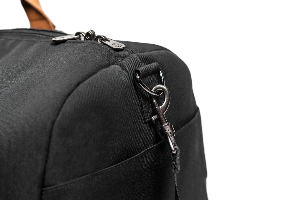 PKG Bishop 42L recycled duffle bag (black) showing d-ring for attachable shoulder strap