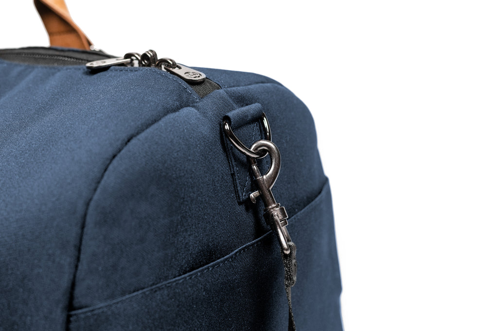 PKG Bishop 42L recycled duffle bag (navy) showing d-ring for adjustable shoulder strap