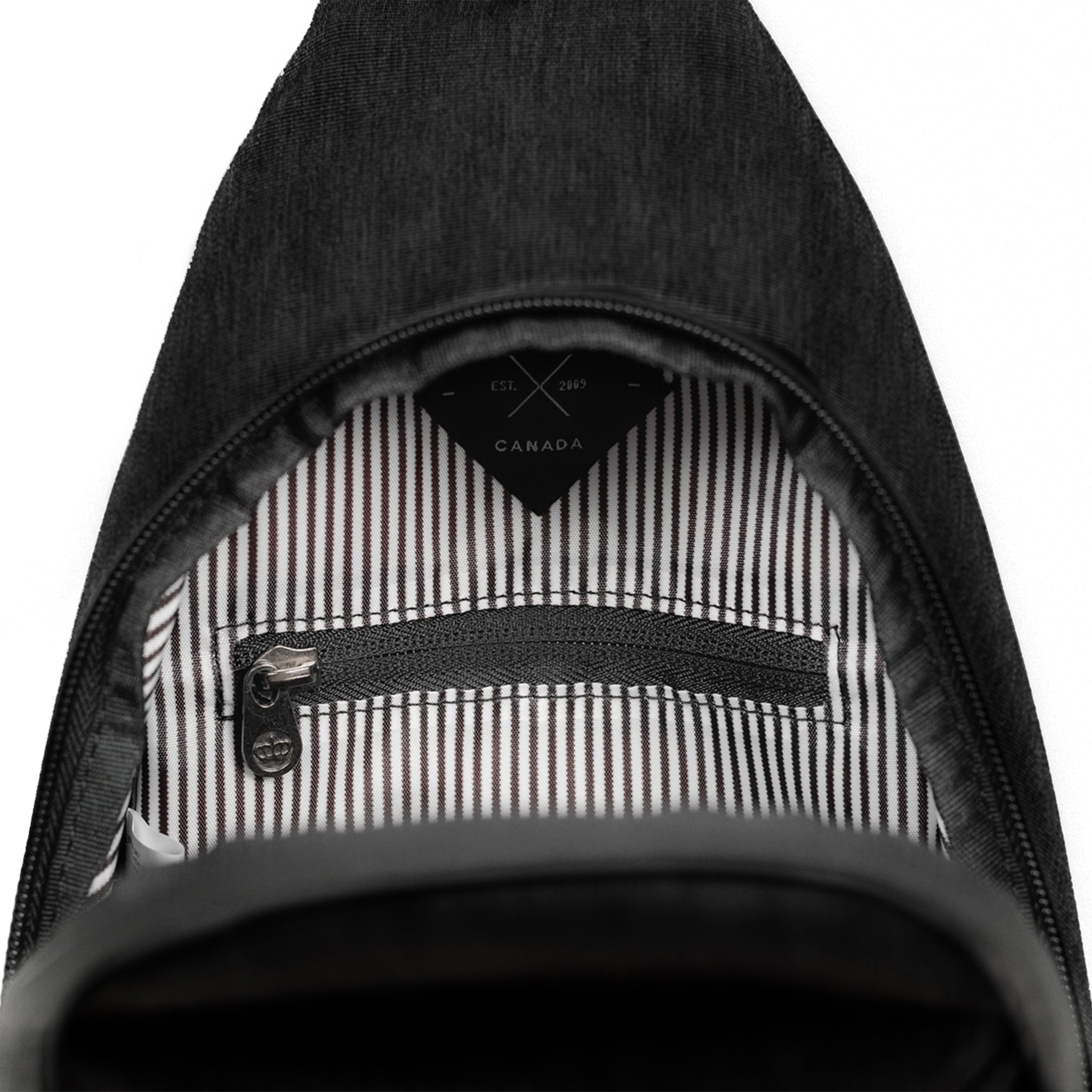 Elora Recycled Cross Body Bag (black) showing inner pocket for valuables