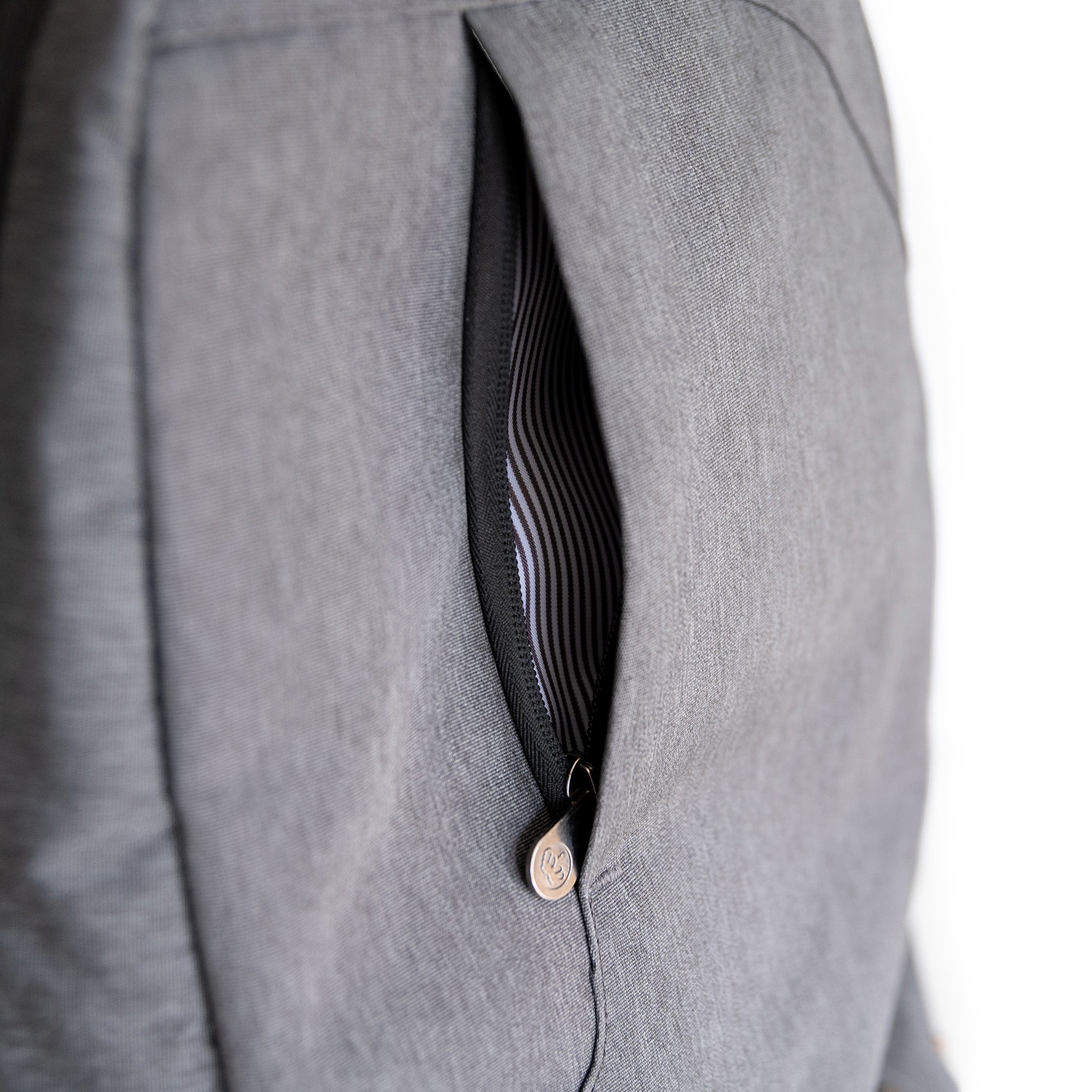 Durham Outpost recycled commuter backpack (dark grey) showing vertical front pocket