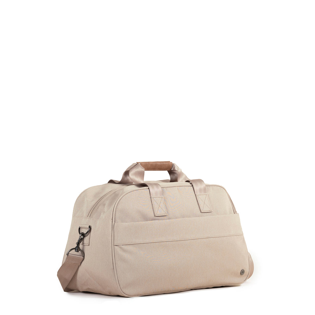 PKG Westmount 26L Recycled Duffle Bag (ginger root) – a midsize daily carry crafted from weather-resistant, recycled 600D polyester. With lockable zippers, padded strap, and vegan leather accents, it's your ideal duffle for eco-friendly adventures