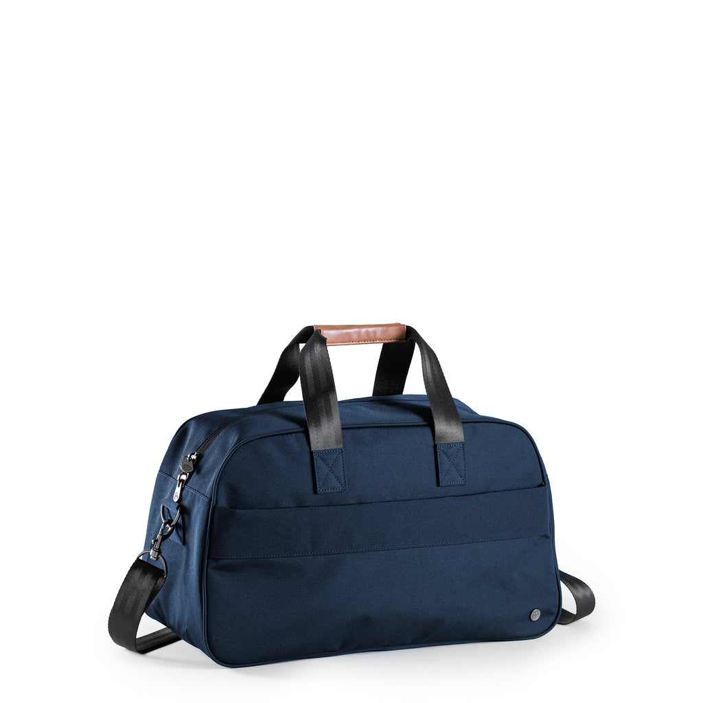 PKG Westmount 26L Recycled Duffle Bag (navy) – a midsize daily carry crafted from weather-resistant, recycled 600D polyester. With lockable zippers, padded strap, and vegan leather accents, it's your ideal duffle for eco-friendly adventures