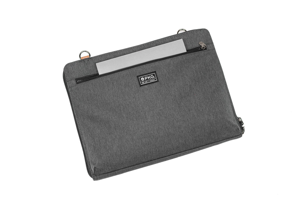 PKG Wellington 10L Messenger (dark grey) showing notebook inserted into external front pocket