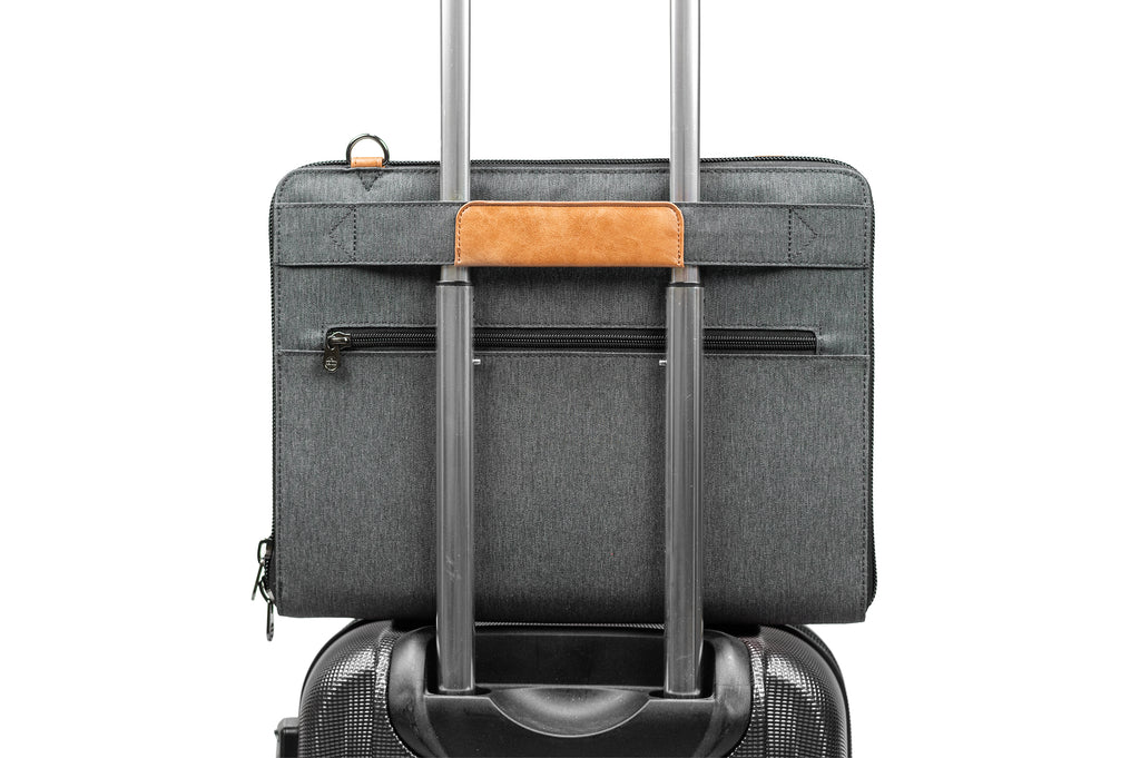 PKG Wellington 10L Messenger (dark grey) attached to luggage handle using trolley strap