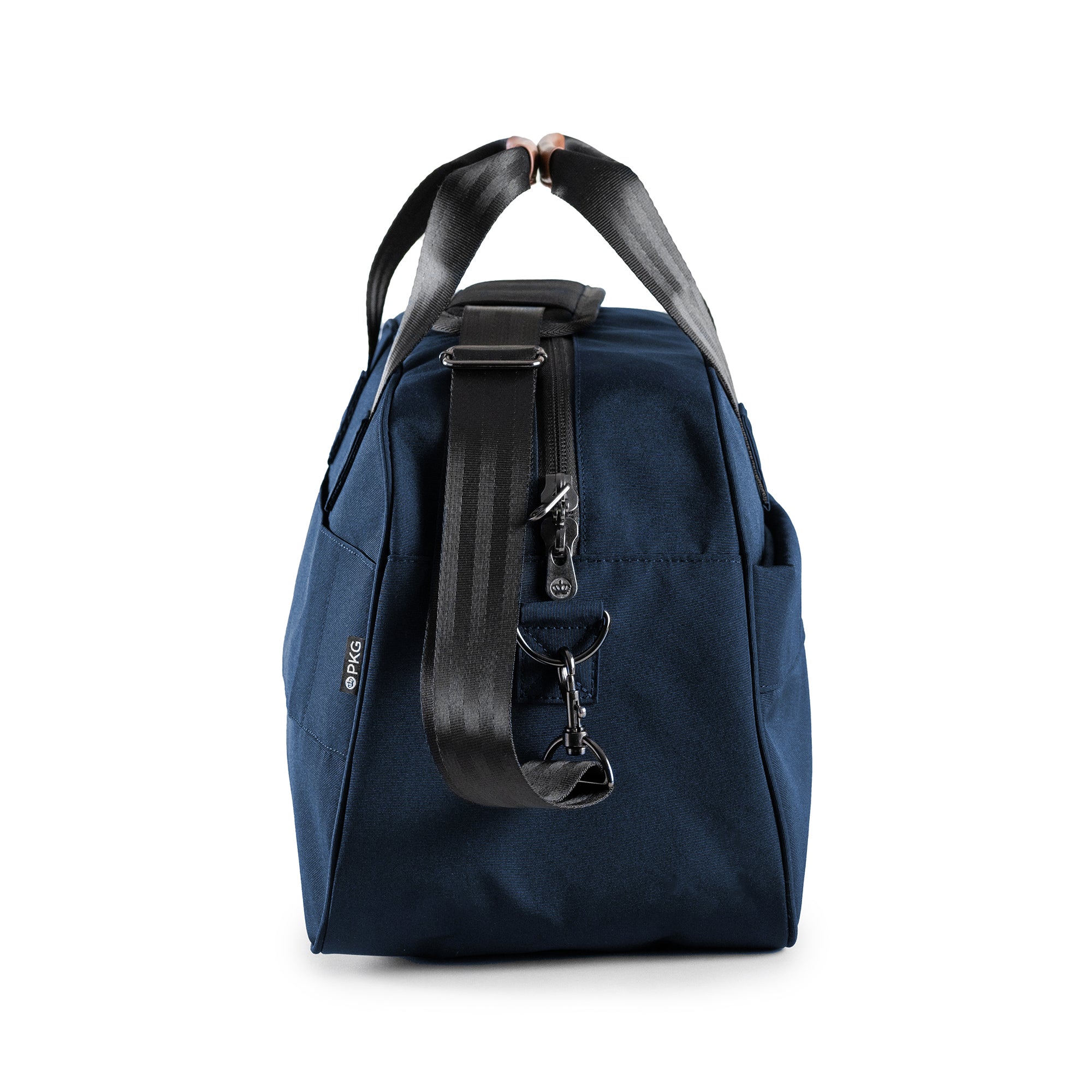PKG Westmount 26L Recycled Duffle Bag (navy) side view showing d-ring connected to detachable shoulder strap