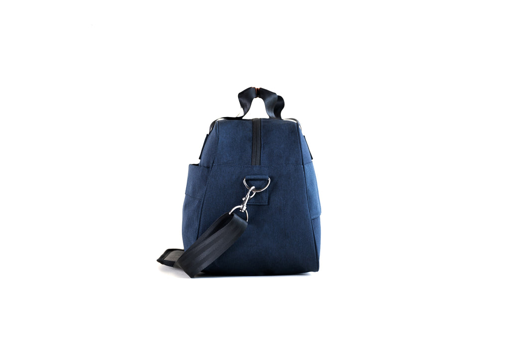 PKG Westmount 26L Recycled Duffle Bag (navy) side view showing d-ring connected to detachable shoulder strap
