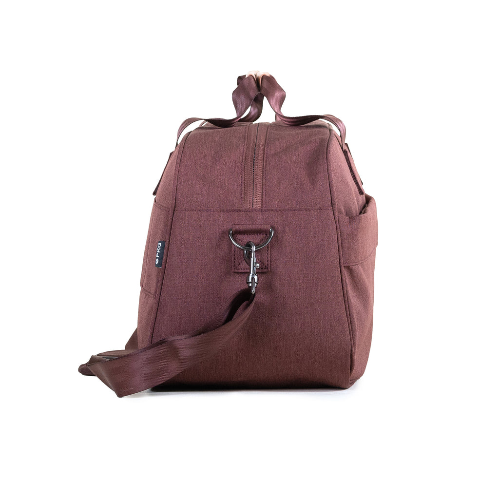 PKG Westmount 26L Recycled Duffle Bag (rum raisin) side view showing d-ring connected to detachable shoulder strap