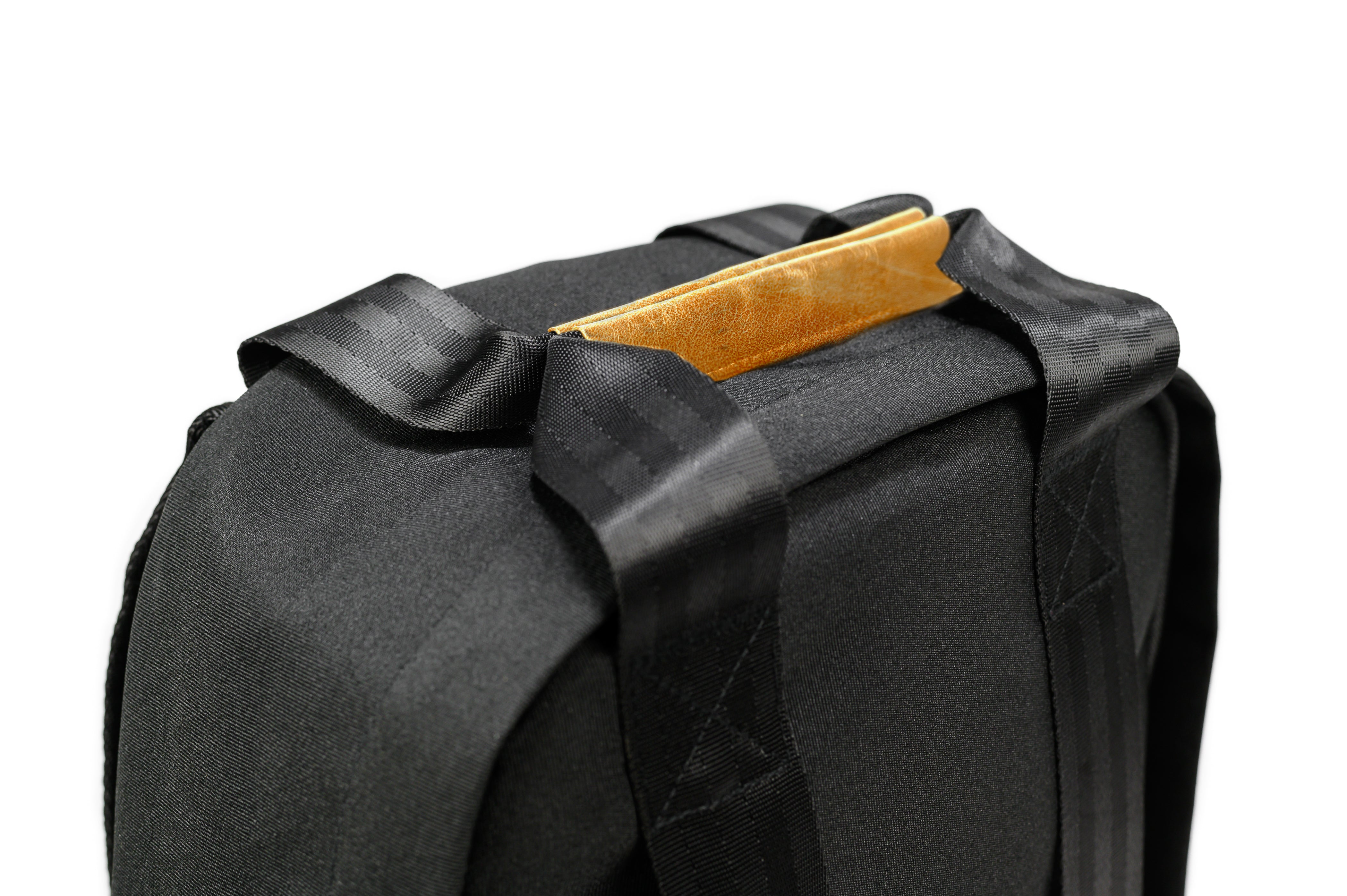 PKG Rosseau 19L Recycled Backpack Tote (black) detailed top view of vegan leather magnetic tote handles for aesthetic and functionality