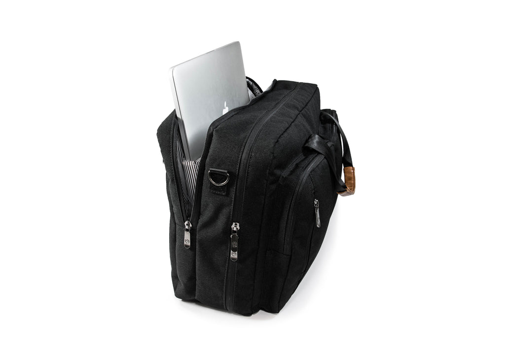 PKG Trenton 31L Messenger Bag (black) showing laptop inserted into dedicated laptop pocket
