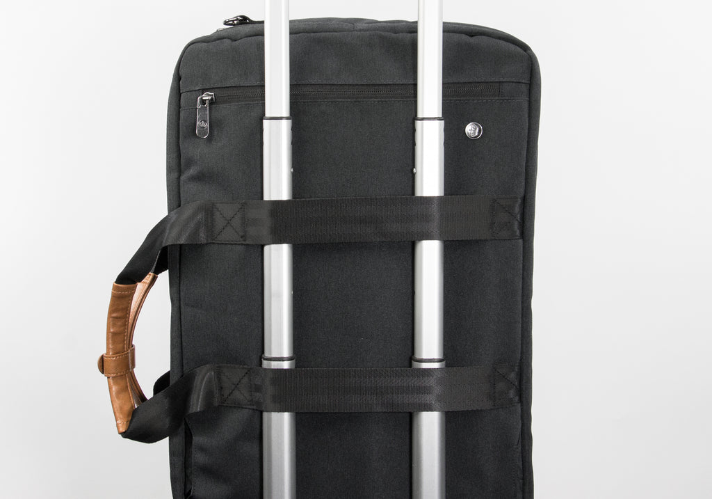 PKG Trenton 31L Messenger Bag (dark grey) connected to luggage handle using trolley strap