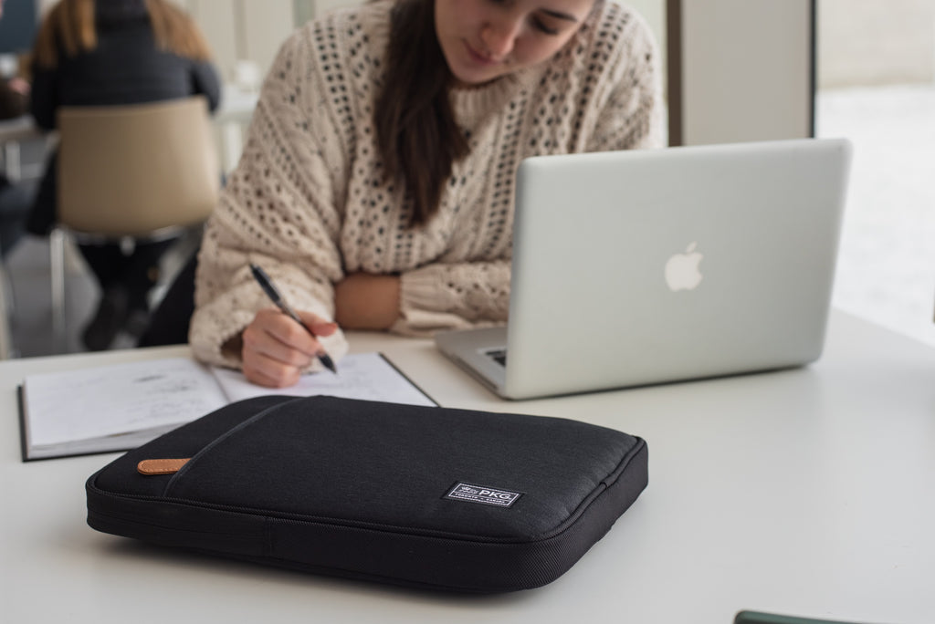 PKG Stuff Recycled Laptop Sleeve (black) resting on table