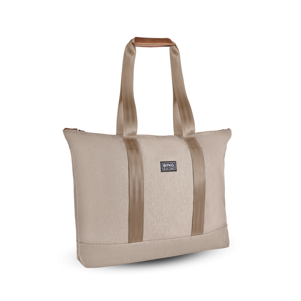 PKG Lawrence 16L Recycled Tote Bag (ginger root). This mid-size tote, made from weather-resistant recycled fabrics, is your ideal everyday carry. With exterior trolley straps, it's perfect for women's purse essentials or a laptop bag