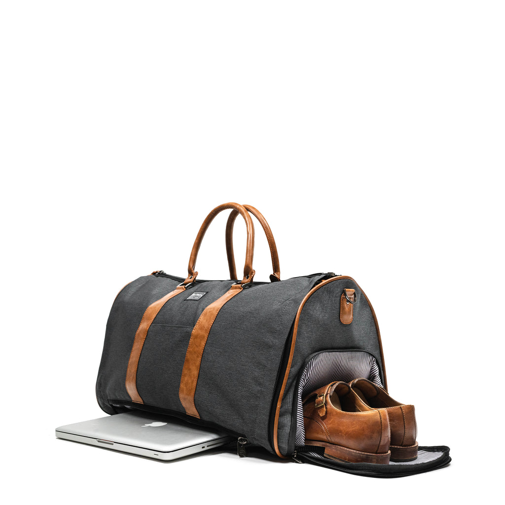 PKG Bishop 42L Recycled Duffle Bag (grey) showing laptop in dedicated laptop compartment as well as dress shoes in dedicated shoe/laundry compartment