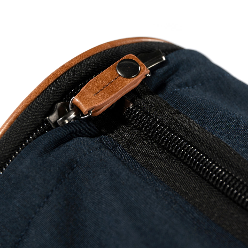 PKG Bishop 42L Recycled Duffle Bag (navy) detailed view of snap lock zippers