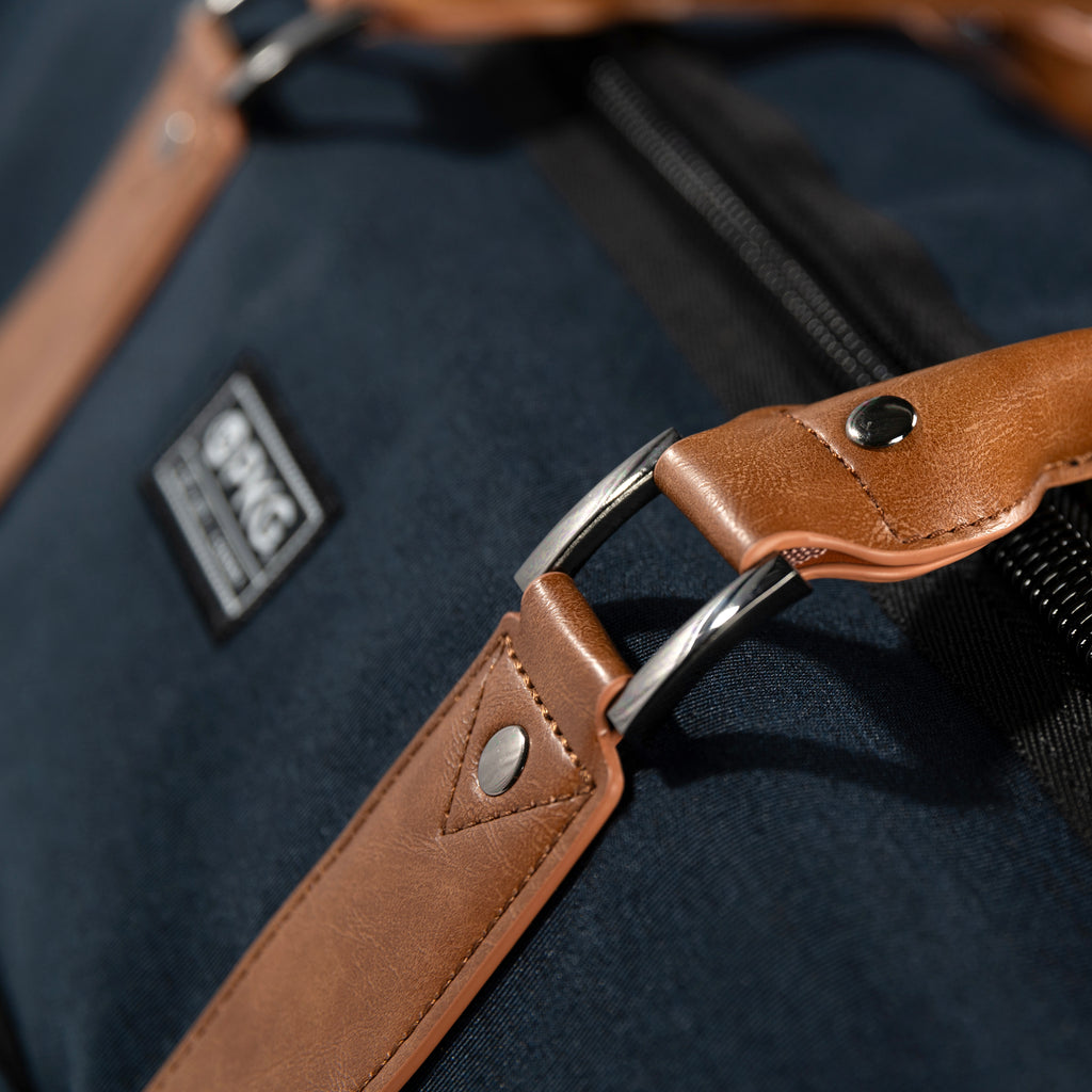 PKG Bishop 42L Recycled Duffle Bag (navy) detailed view of reinforced vegan leather handles
