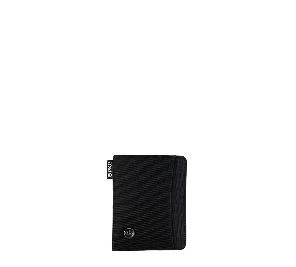 PKG Perry RFID Passport Wallet (black) – your go-to for secure travel organization. Crafted from durable vegan leather, this wallet accommodates 4-6 cards, your passport, boarding pass, and cash
