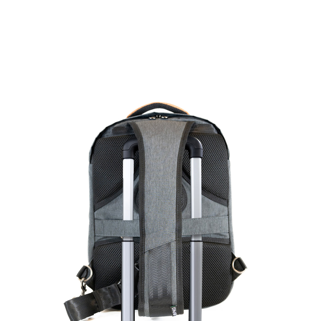 PKG Robson 12L Cross-Body Laptop Bag attached to luggage using trolley strap