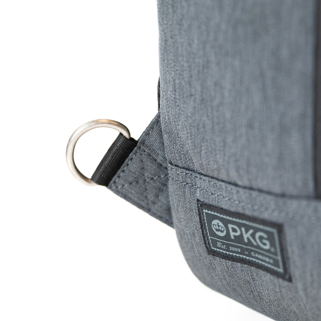 PKG Robson 12L Cross-Body Laptop Bag showing d-ring for attaching adjustable shoulder strap