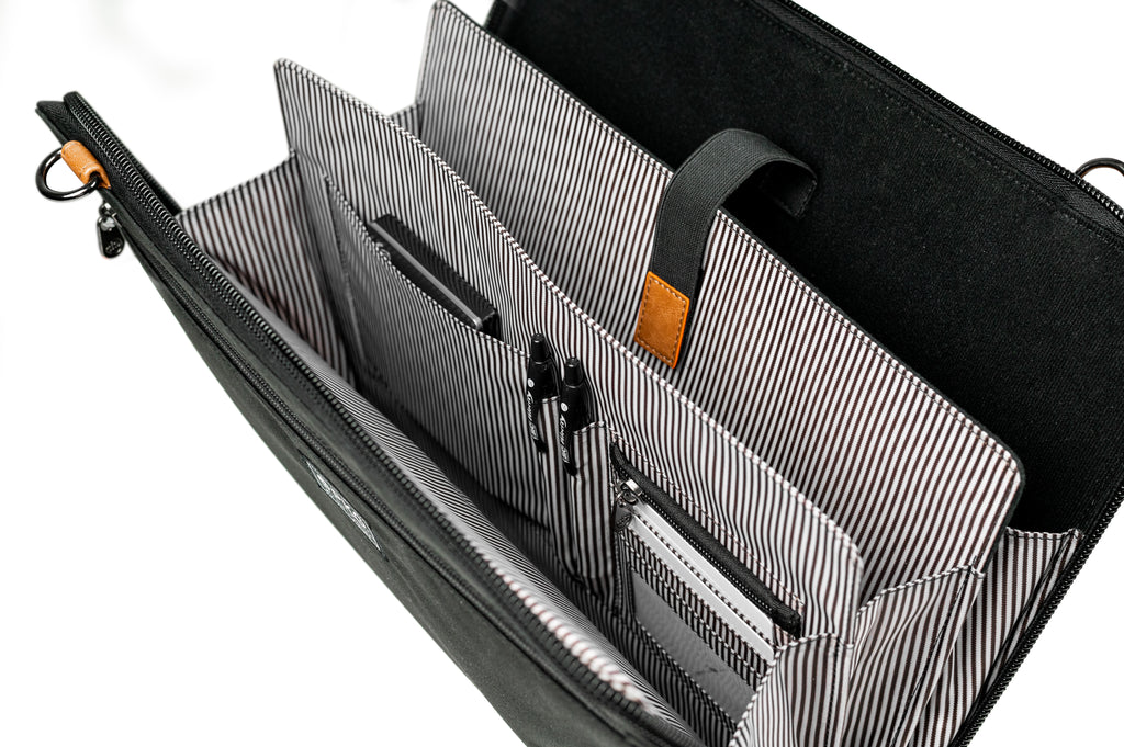PKG Wellington 10L Messenger (black) top view open, showing accordion style file slots with built in organization for office equipment and laptop