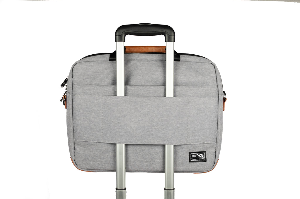PKG Annex recycled messenger shoulder bag (light grey) trolley strap on luggage handle