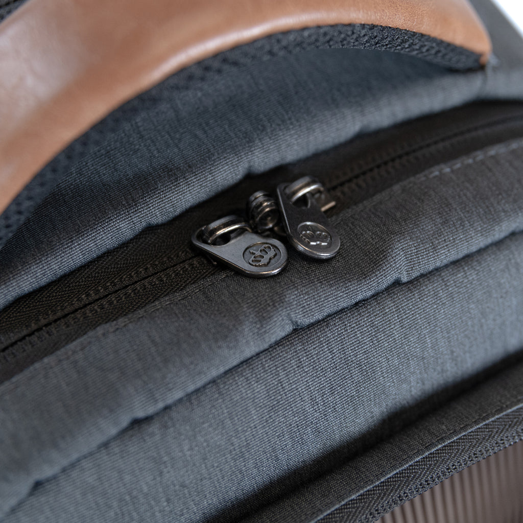 PKG Aurora recycled backpack (grey) showing lockable zippers