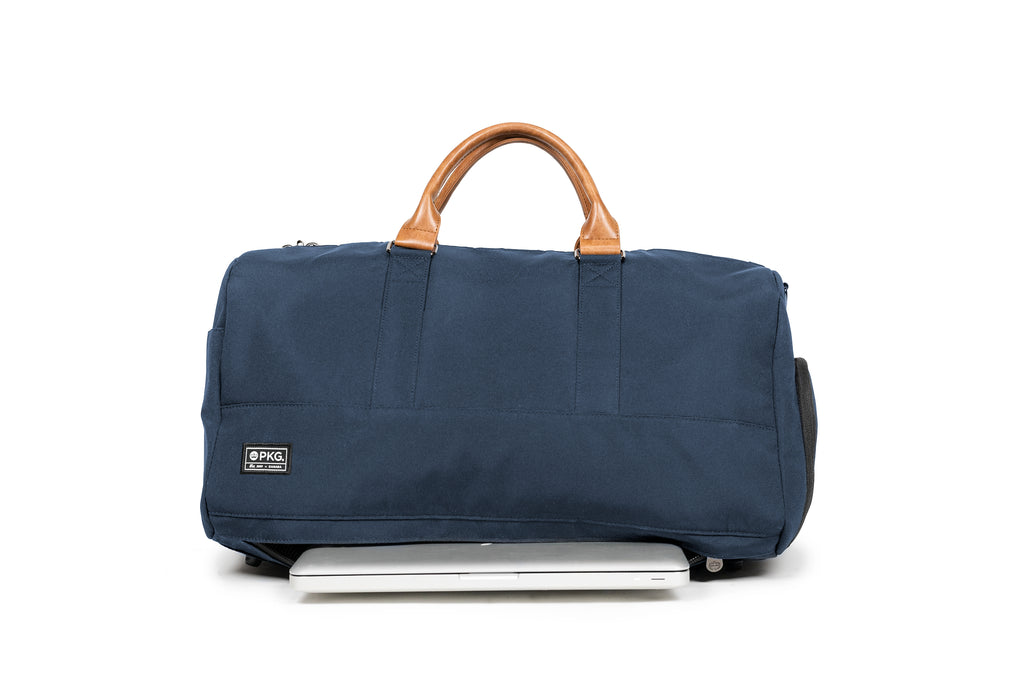 PKG Bishop 42L recycled duffle bag (navy) showing dedicated padded laptop compartment