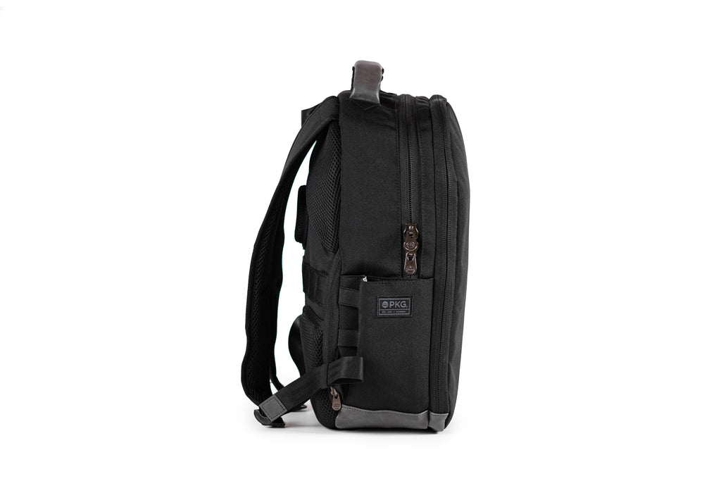 PKG Durham Commuter 17L recycled backpack (black) side view showing water bottle pocket