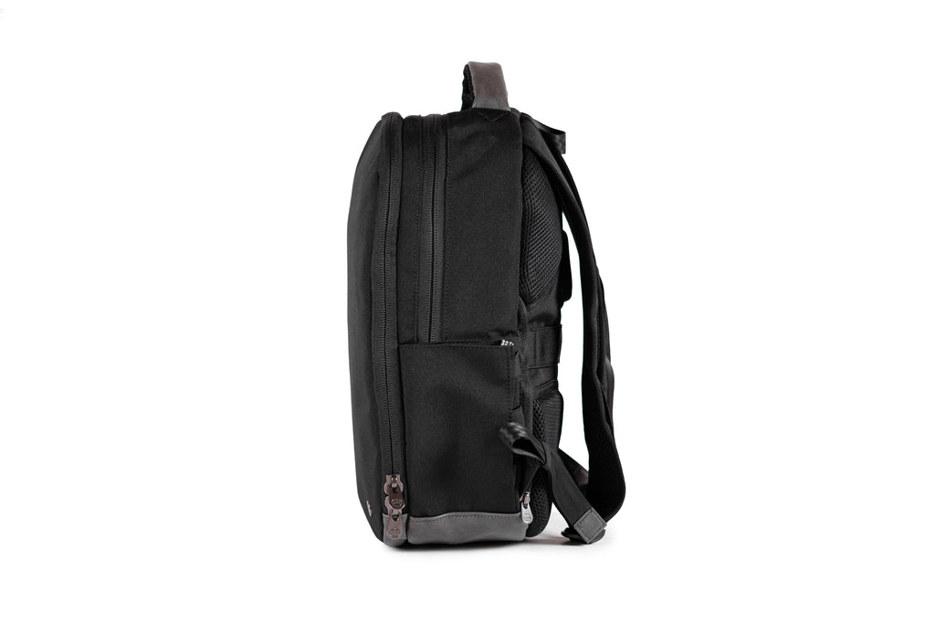 PKG Durham Commuter 17L recycled backpack (black) side view showing water bottle pocket