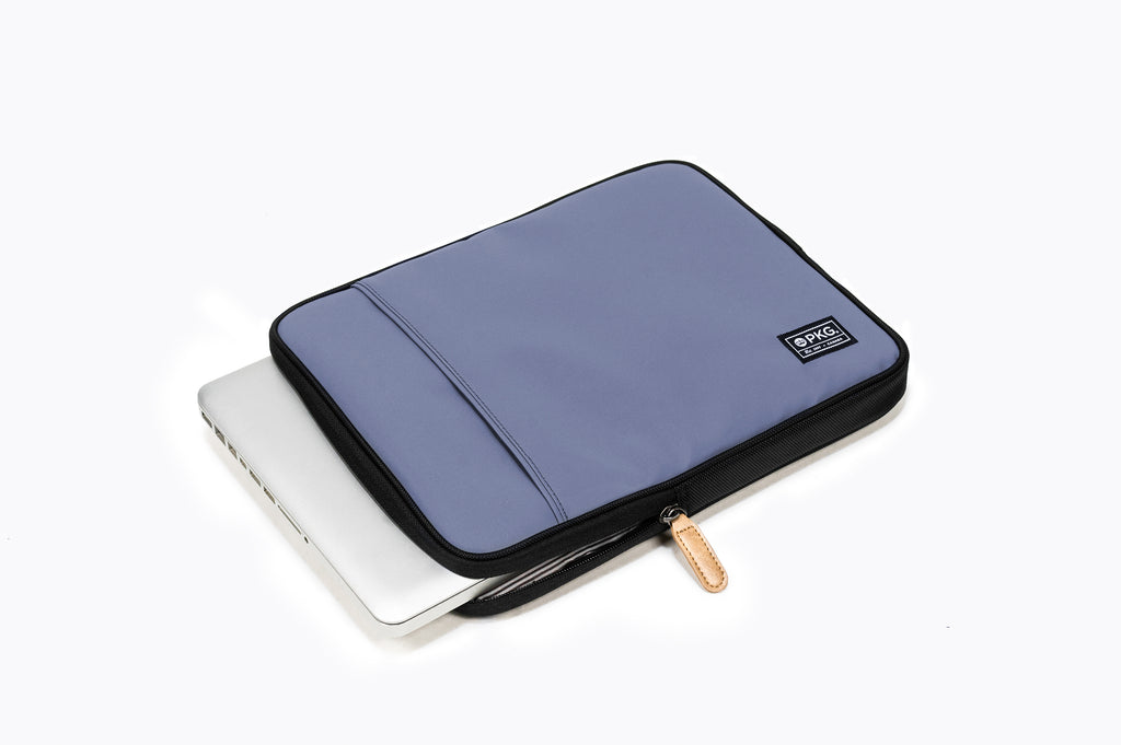 PKG Stuff Recycled Laptop Sleeve (vintage blue) shown with laptop inserted into main compartment