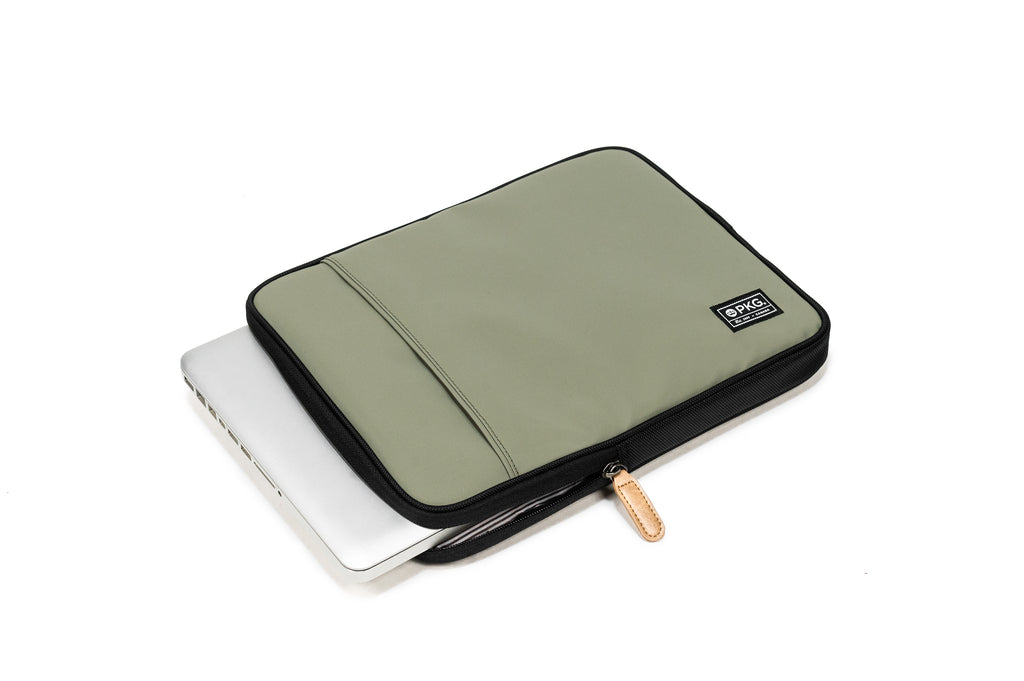 PKG Stuff Recycled Laptop Sleeve (tranquil green) shown with laptop inserted into main compartment