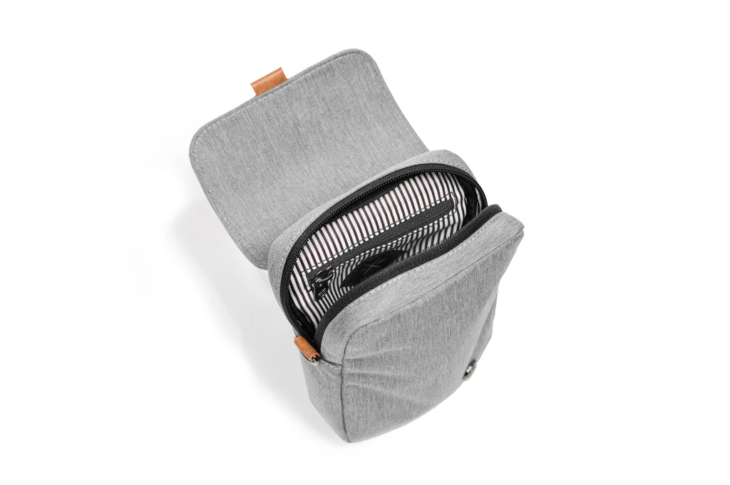 PKG Burrard recycled cross body bag (light grey), top open view showing inner lining and organization