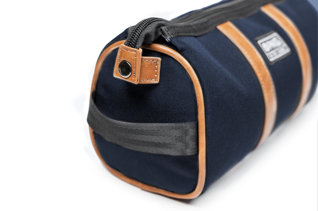  PKG Charlotte Recycled Toiletry Bag (navy) showing side strap 