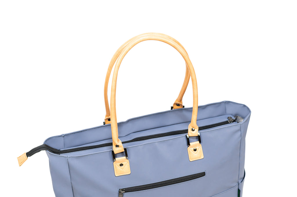 PKG Georgian 33L Recycled Tote Bag (vintage blue) top angled view showing reinforced faux leather handles and zipper to close