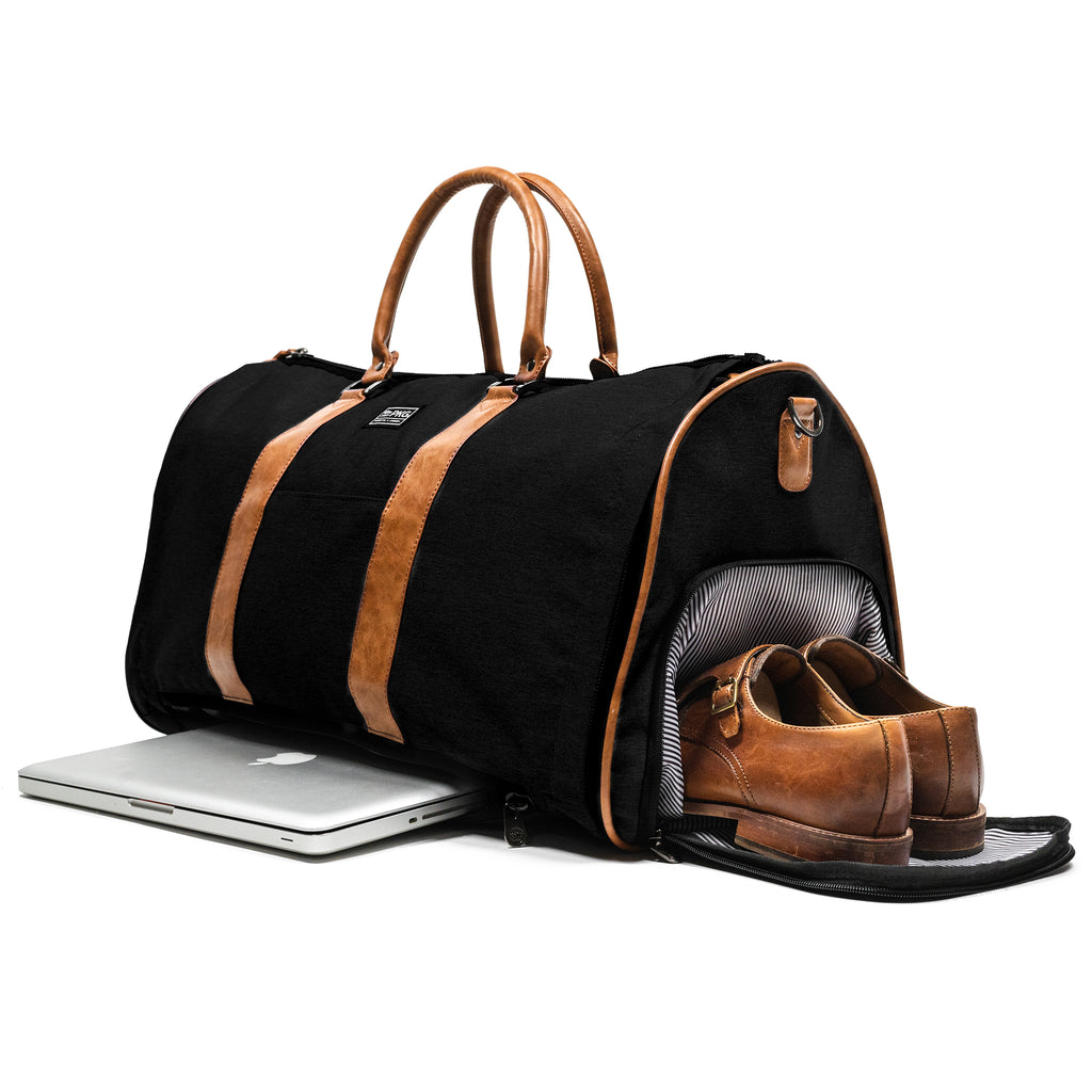 PKG Bishop 42L Recycled Duffle Bag (black) showing laptop in dedicated laptop compartment as well as dress shoes in dedicated shoe/laundry