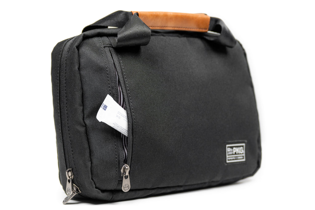 PKG Simcoe accessory bag (black) example of small toiletry product being stored in back pocket