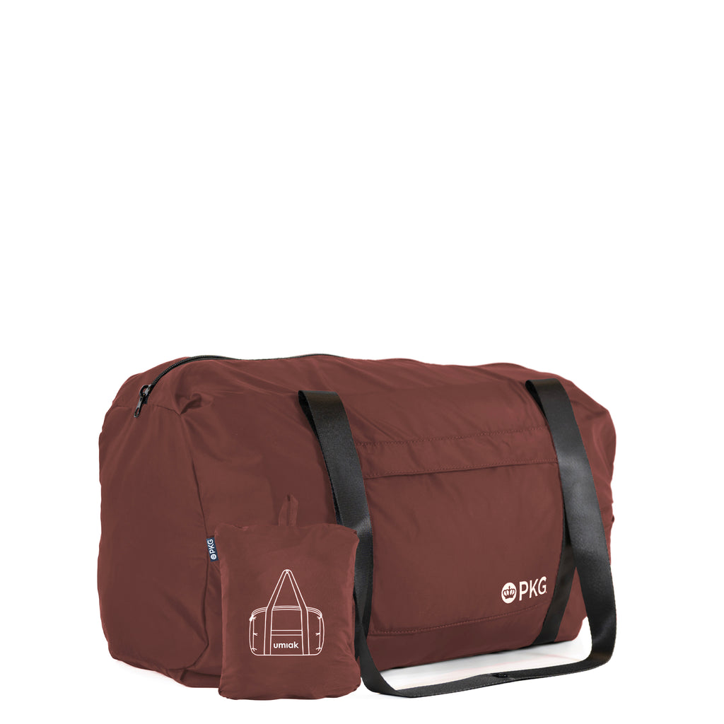 PKG umiak 31L Recycled Duffel (rum raisin), your eco-friendly everyday travel companion. Built with 100% recycled, water-resistant, and tear-resistant material. Antimicrobial, odor-resistant, and exceptionally durable with reinforced seams