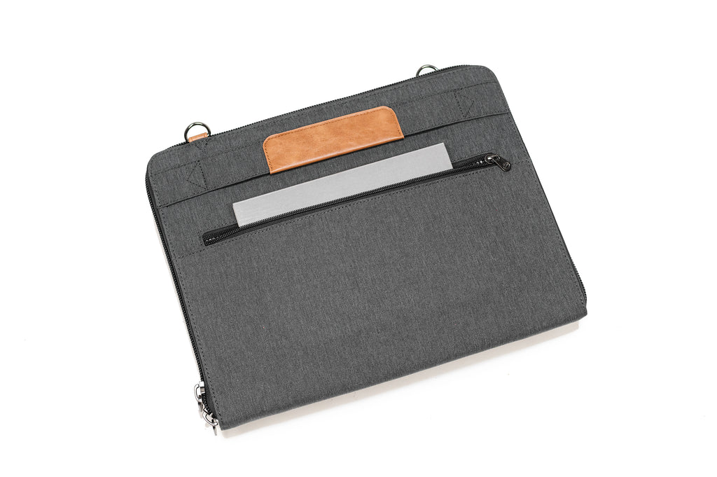 PKG Wellington 10L Messenger (dark grey) showing notebook in external back pocket
