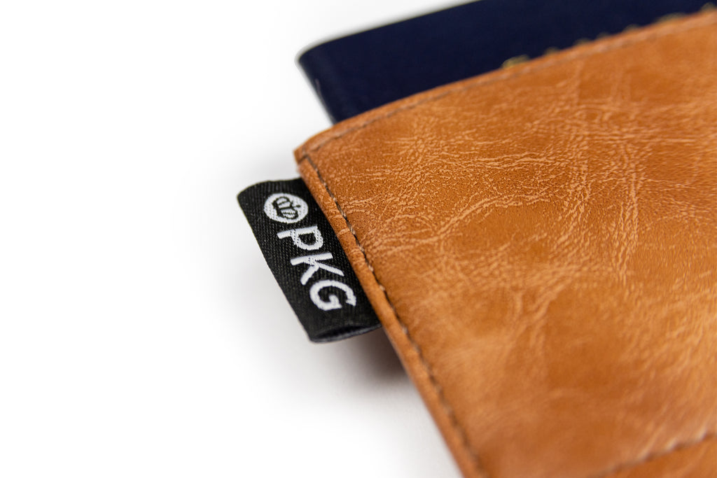 PKG Perry RFID Passport Wallet (tan) detailed view showing durable vegan leather material