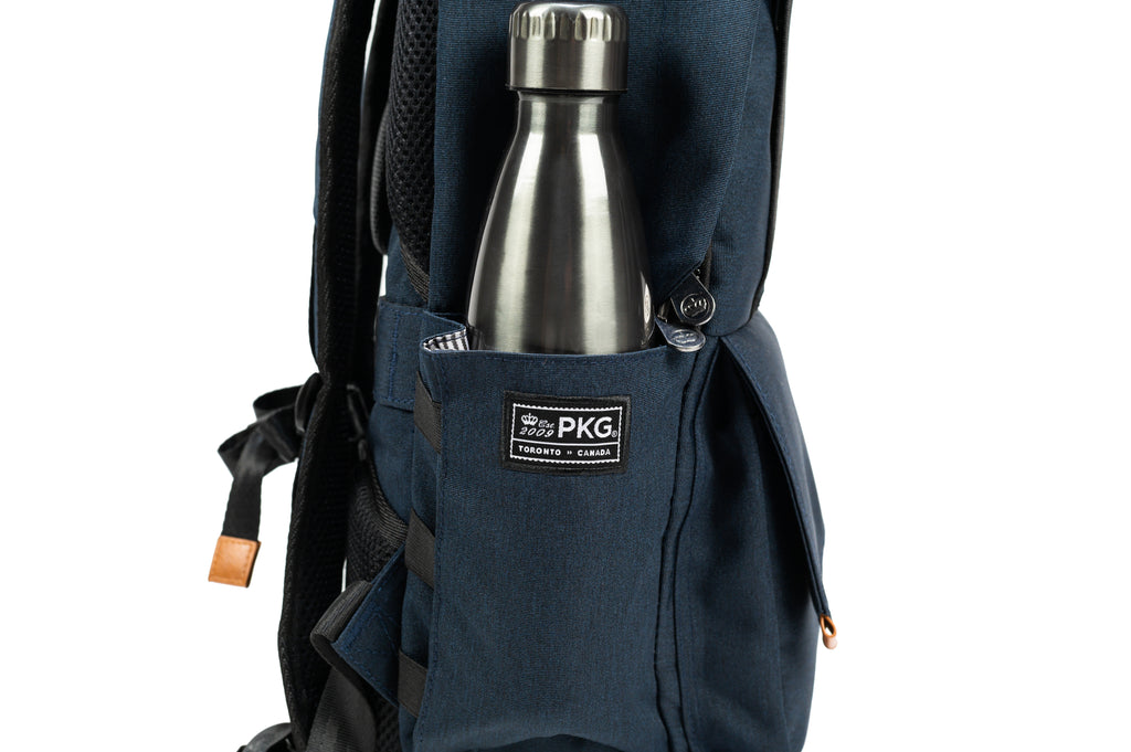 PKG Rosseau 19L Recycled Backpack Tote (navy) side view showing water bottle pocket with bottle inside