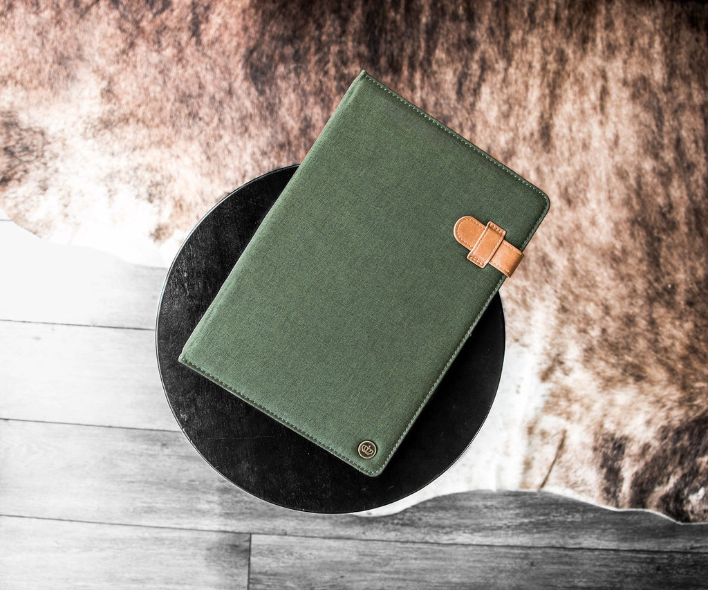 Universal Tablet Folio (green) resting on backdrop'